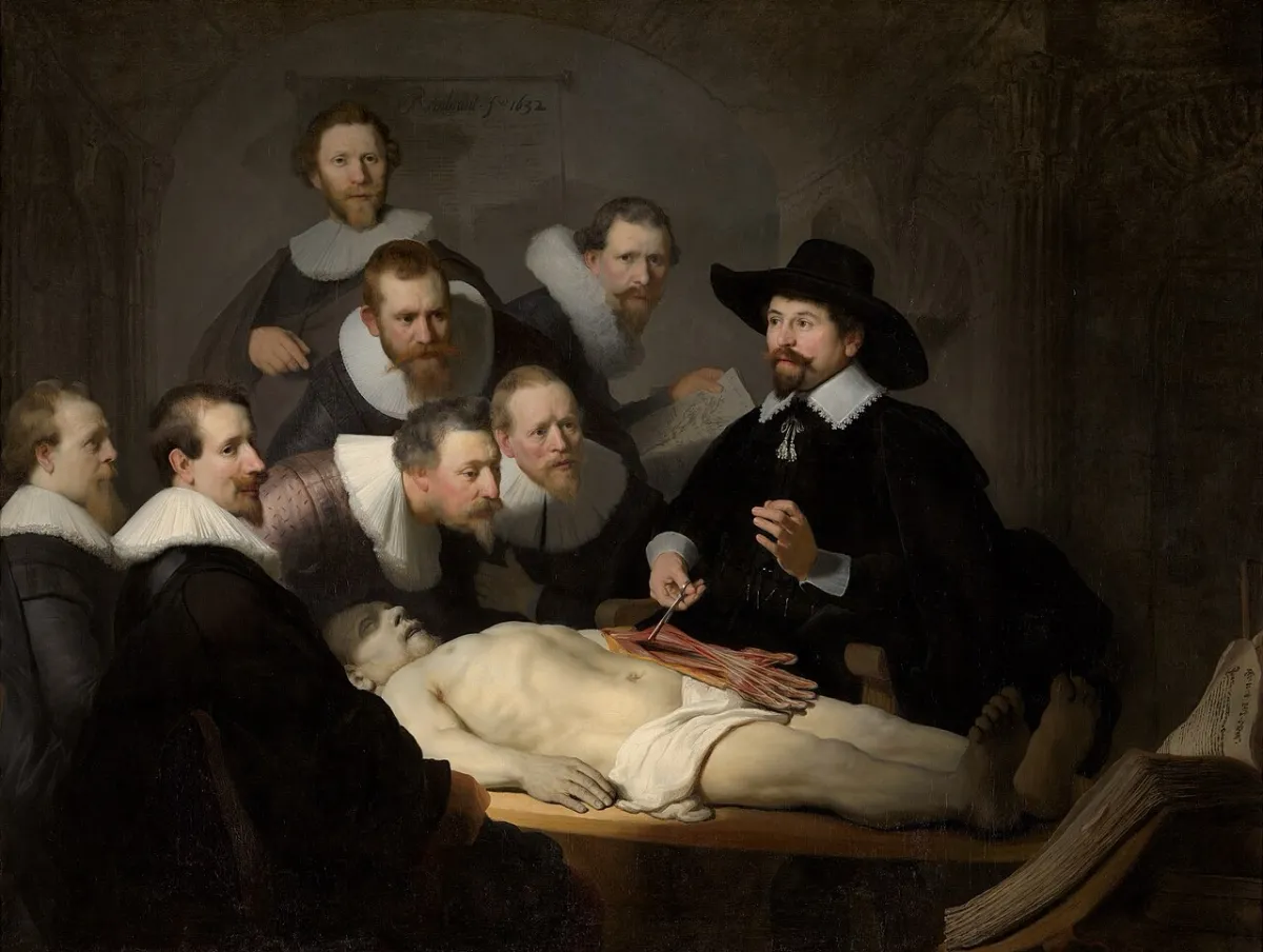 Dr. Tulp demonstrates the anatomy of an arm to a circle of surgeons leaning in to watch.