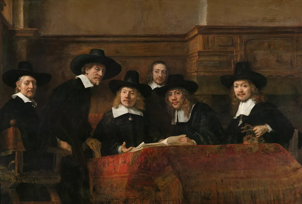 Five guild officials in black hats look up from an open ledger on a red table, as if someone just walked in.